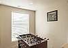 Upstairs foosball table located between recreation room and outdoor patio.