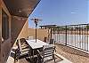 Back patio dining area with pool view