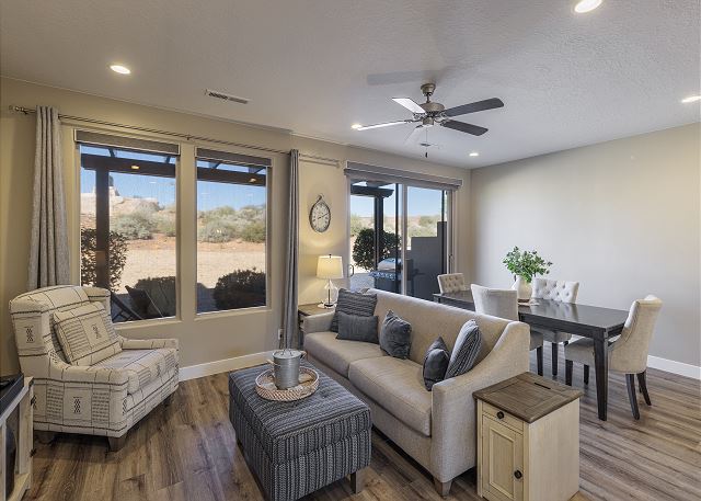 The living room is conveniently adjacent to the kitchen. There is also access to the back patio which has a BBQ grille suitable for all your favorite BBQ dishes.