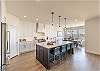 This sleek, modern kitchen has all the best upgrades to make cooking a breeze!