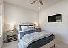 Bedroom 4 includes a Queen bed, private TV, and closet.