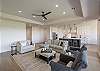 The living room is designed as an open floor plan and is a great gathering place for meals, games, or watching TV during your stay. 