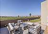 Stay warm next to the fire-pit and relax while looking out over the golf course. 