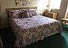 King Bed off living area with sliding doors