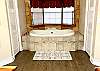 Jacuzzi tub, walk in shower, his & her sinks