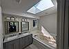 ...features a jetted soaking tub.