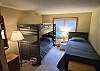 Offers a single Bunk Bed with a single Twin Bed.
