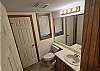 Enter the unit, turn left and you'll find this 1/2 bath that services the main floor next to a full laundry room.