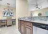 The spacious kitchen offers stainless appliances and granite countertops.