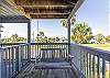 Sway on the porch swing while you sip morning coffee and enjoy the coastal breeze.