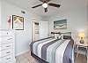 Guest Bedroom: Queen-size bed, chest of drawers and roomy closet—tasteful coastal décor creates a calm, welcoming ambiance.