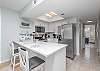 Gourmet-Ready Kitchen offers plenty of cabinetry with quartz countertops, stainless-steel appliances, farmhouse sink and seating. Fully stocked and ready for you to prepare meals during your stay.