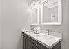 The private bathroom has been completely renovated and features a beautiful, double vanity and new lighted mirrors.