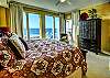 The large primary bedroom offers spectacular views of the Gulf of Mexico, as well as balcony access. 