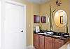 The private bathroom features a private water closet, double vanity, and is fully stocked with linens for your stay.