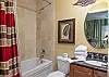 This private bathroom features a tub/shower combo, single vanity, and is fully stocked with linens for your stay.