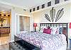 The primary bedroom features king bedding, is beautifully furnished, and offers a private bathroom oasis.
