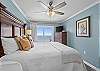 The gulf front, primary bedroom features King bedding, excellent views of the Gulf of Mexico, and balcony access.
