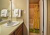 This bathroom features a tub/shower combo, single vanity, and is fully stocked with linens for your stay.
