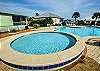 Pool #1 features a large pool with a kiddie pool, a small clubhouse and restrooms