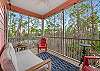 The spacious, screened porch offers seating and is a great space for enjoying outdoors.