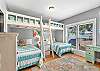 Guest bedroom 1, aka 'kids nook', features built in bunks and full size beds underneath. Although this is a great space for the kids, it is also comfortable enough for sleeping adults.
