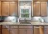 The custom cabinetry in the kitchen is fully stocked with all items needed for preparing meals during your stay.