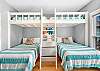 Guest Bedroom 1 offers built in bunks with full size beds underneath. This space will sleep 6 easily.