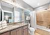 The private bathroom offers a tub/shower combo, single vanity and is fully stocked with linens for your stay.