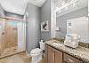 The large guest bathroom offers a standing shower, single vanity and is fully stocked with linens for your stay.