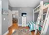 Guest bedroom 1 offers built in bunks, a chest of drawers for storing personal belongings and a television for enjoying in your down time.
