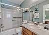 Bathroom 1 offers a single vanity, tub/shower combo and is fully stocked with linens for your stay