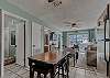 The kitchen offers space for dining that provides a table with seating for 4