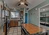 The kitchen offers a dining table with seating for 4