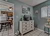 Bedroom 2 offers a dresser and flat screen television with DVD