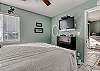 Bedroom offers a chest of drawers for storing your personal belongings and a mounted flat screen television