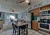 The spacious kitchen offers stainless appliances and is fully stocked with everything needed for preparing meals