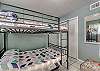 The guest bedroom offers full over full bunk beds