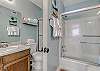 Bathroom 1 offers a tub/shower combo, single vanity and is fully stocked with linens for your stay