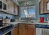 The kitchen offers both large and small appliances to assist with meal prep