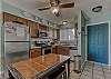 The spacious kitchen offers stainless appliances and is fully stocked with all items you need for cooking during your stay