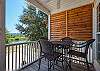 A pub style table with seating for 4 is featured on the balcony and overlooks Stanton Creek.