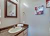 A half bathroom is located on the main floor just off the kitchen for your convenience.