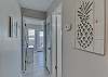From the kitchen, follow the short hallway to the bathroom and bedroom