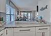 The spacious kitchen offers an eat in bar that offers seating for 3