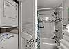 The bathroom offers a stack washer/dryer for convenience