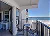 The private balcony offers side views of the Gulf of Mexico