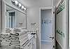 The bathroom is fully stocked with linens for your stay