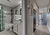 The bathroom offers plenty of drawers and a cabinet for storing your personal items out of sight