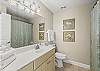 The private bathroom features a tub/shower combo, single vanity, and is fully stocked with linens for your stay.